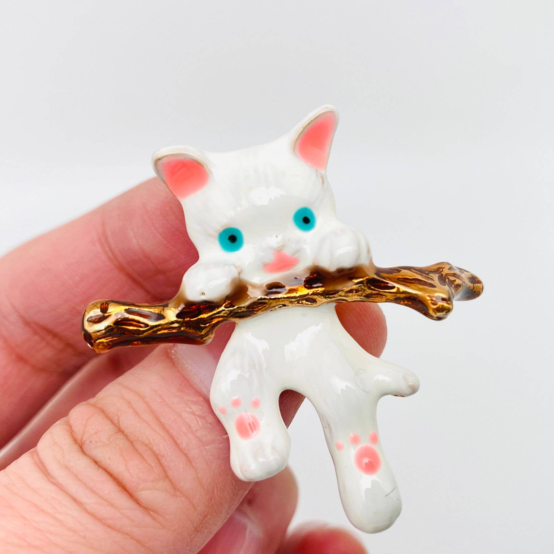 White Cat Hanging On A Branch Enamel Brooch - Spiral Circle